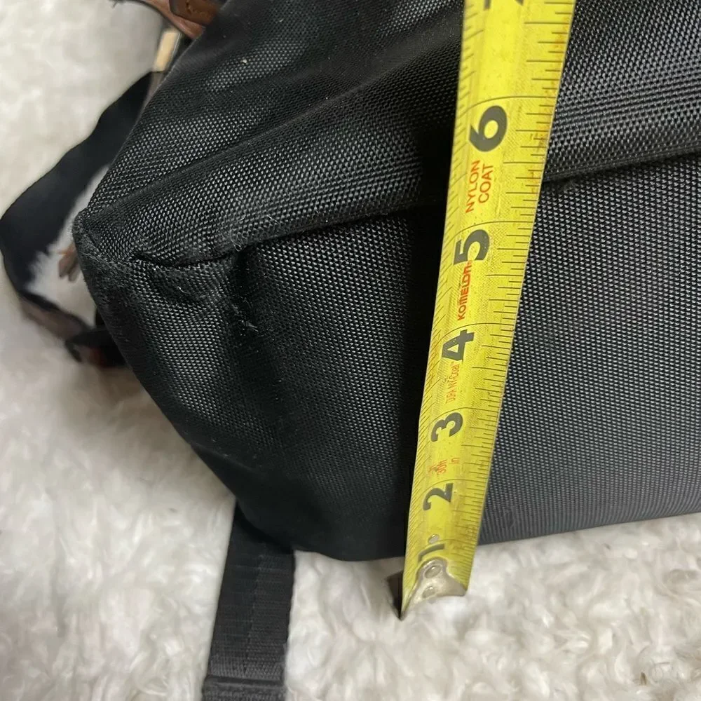 Tommy Bahama Black Laptop Case Backpack With Brown trims and straps .